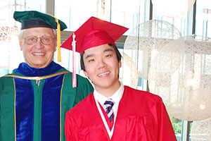 EvCC graduate Yihua Tan with President David Beyer.