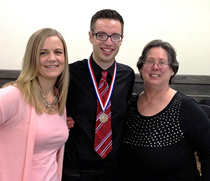 Outstanding graduate Colby Droullard with Dr. Diane Brown (left) and Cynthia Clarke