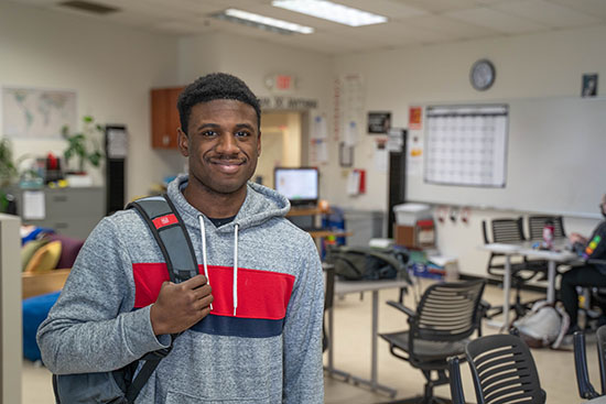 A student stands in the classroom