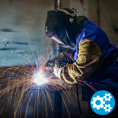 A student welds, with an icon of a gear in the corner.