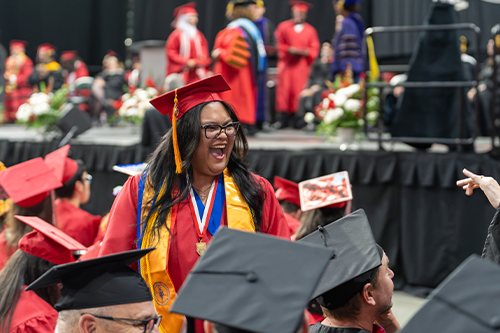 Taliyah gives an excited yell at commencement. 