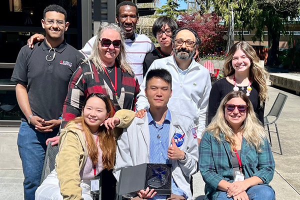 International student William (Po Chun) Chou with the International Education staff and fellow International students