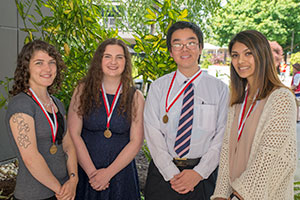 Yihua Tan (second from left) at EvCC's 2018 outstanding graduate reception.