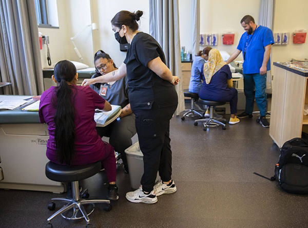 Students learn how to do hemoglobin, hematocrit and glucose tests on Wednesday, Aug. 7, 2024 in Everett, Washington. (Olivia Vanni / The Herald)
