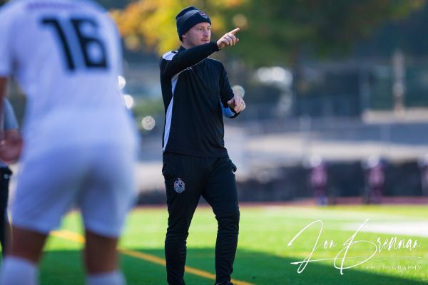 Everett Community College men’s soccer coach Kieren Raney directs his team during a game. On Aug. 24, Raney set a new all-time record of 39 career wins after the 2-0 victory against Centralia College, surpassing the previous coach, Erik Cruz, and his 36 wins. (Photo courtesy of EvCC Athletic Director Garet Studer)