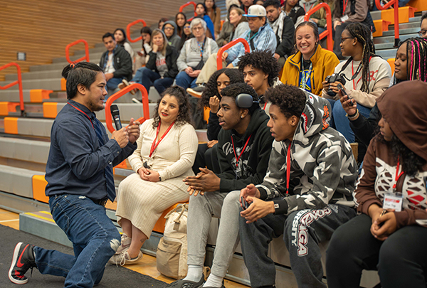 Keynote speaker Michael Tuncap, a higher education and non-profit leader, interacts with students during the opening ceremony at the Students of Color Career Conference at Everett Community College March 21.