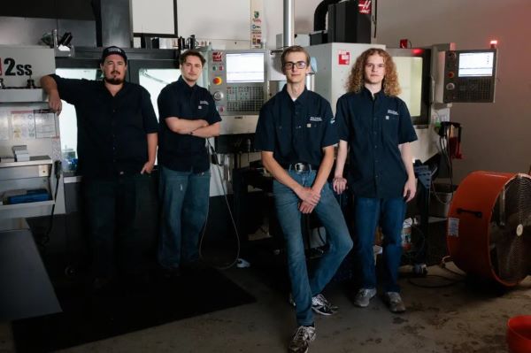 Wyatt Curry, second from right, with his instructor, Joe Bauer, left, and his teammates Phoenix Farrell, second from left, and Adam Davis.Credit...