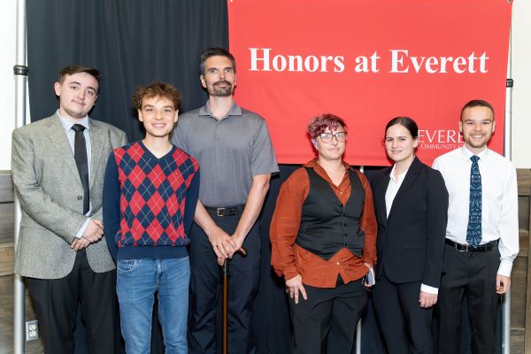 EvCC Honors graduates (left to right) Justin Nordin, Keegan Raub, Phillip Patzer, Moss Martin, Addison Buell and Tavish Raub at the Everett Community College Honors Forum on June 3.