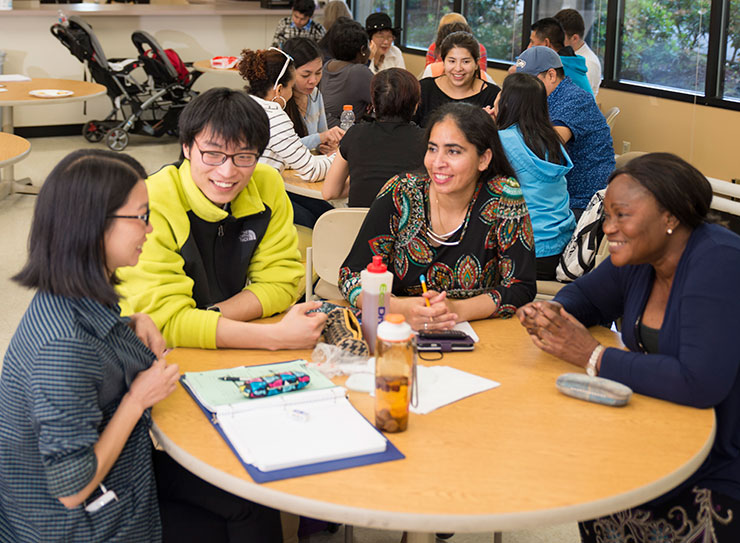A diverse group of students use the BRIDGES Center