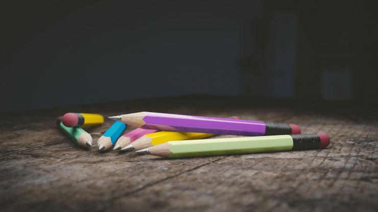 colorful pencils in a pile on a desk